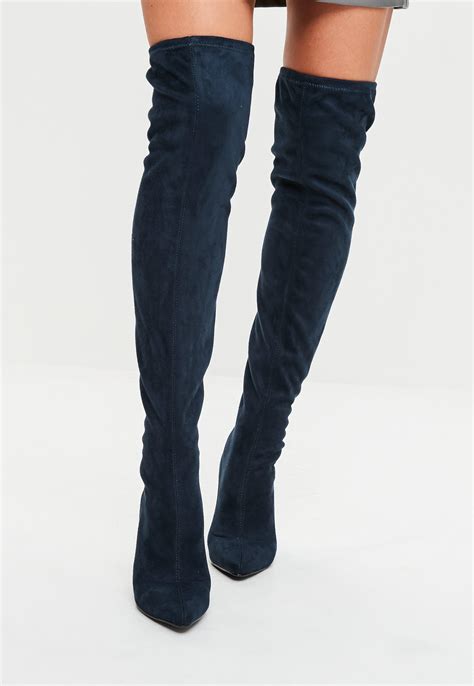 navy blue knee length boots.